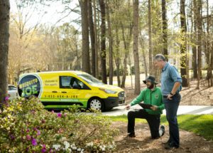 Mosquito Joe Technician teaching customer about Mosquito Control Services.